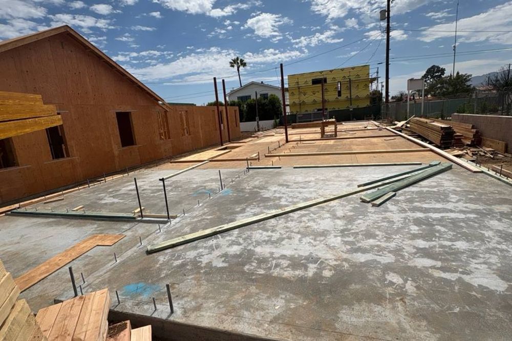 Foundation pour &mdash; finished concrete slab with anchor bolts set